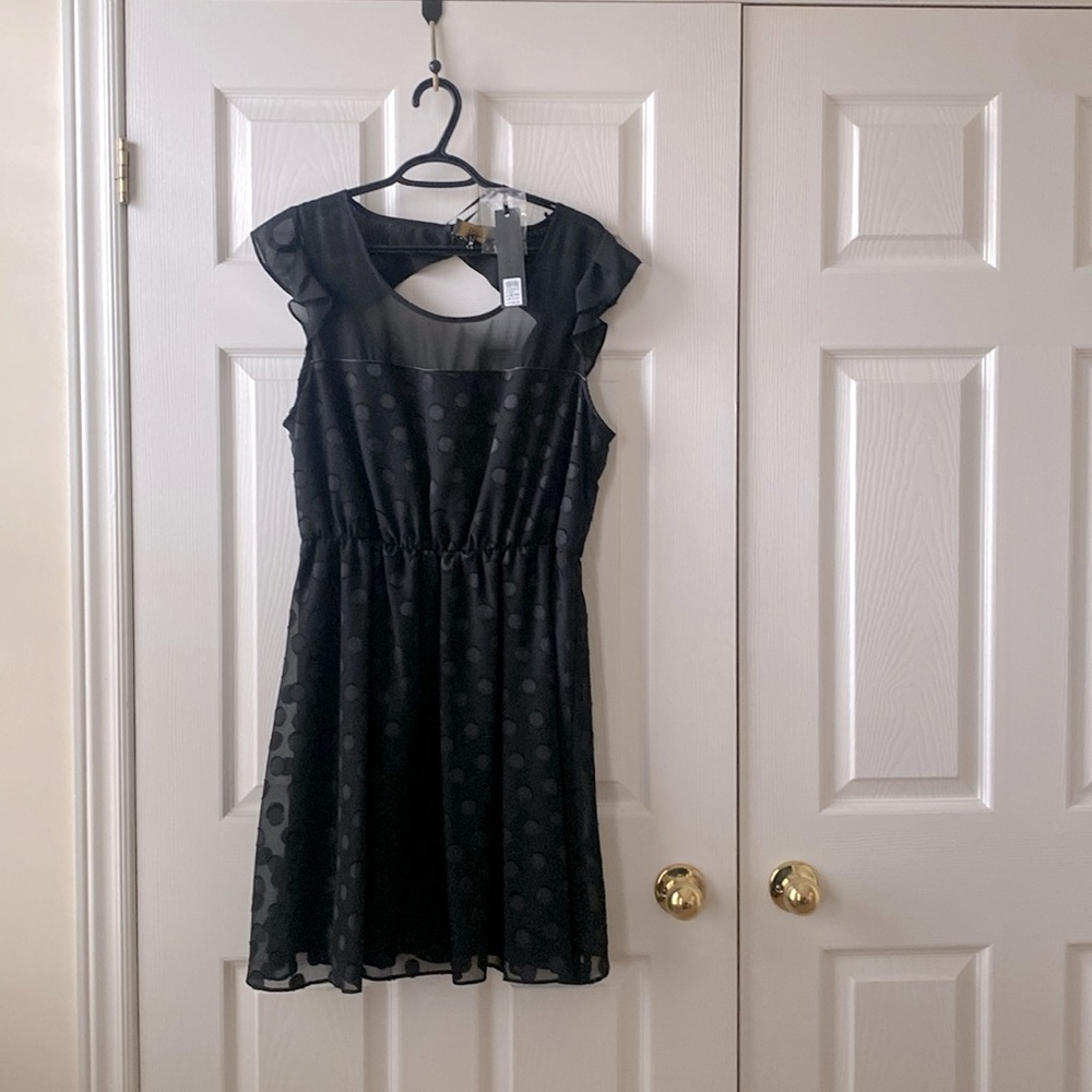 Black polka dotted cocktail dress
